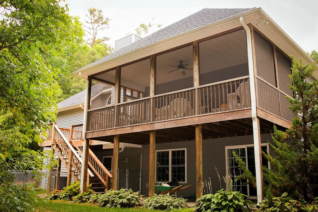 back porch, rear porch, back patio, rear patio, deck, backyard, rear elevation, house, home, hostas, staircase, stair, rear entrance, residence, screened porch, brown home, deck, d