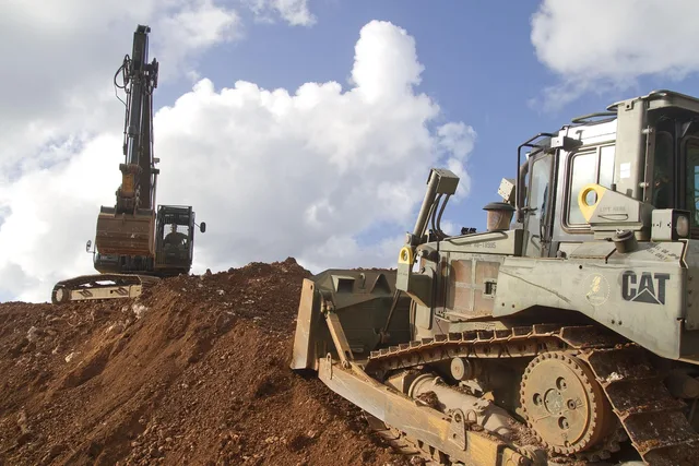 guam, bulldozer, equipment, machines, industrial, sky, clouds, excavating, moving earth, nature, outside, working, guam, bulldozer, bulldozer, bulldozer, bulldozer, bulldozer. Can one contractor handle an outdoor space makeover's grading and drainage together?