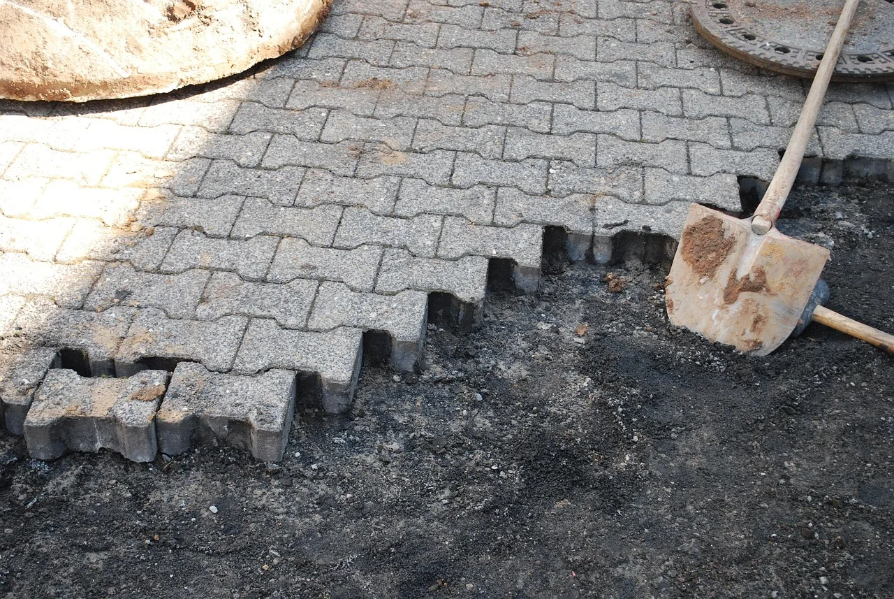 construction site, pokes fun at, to build, unfinished, road, cobblestone, unfinished, unfinished, unfinished, unfinished, unfinished. Trialing patio project materials on a small area beats guessing